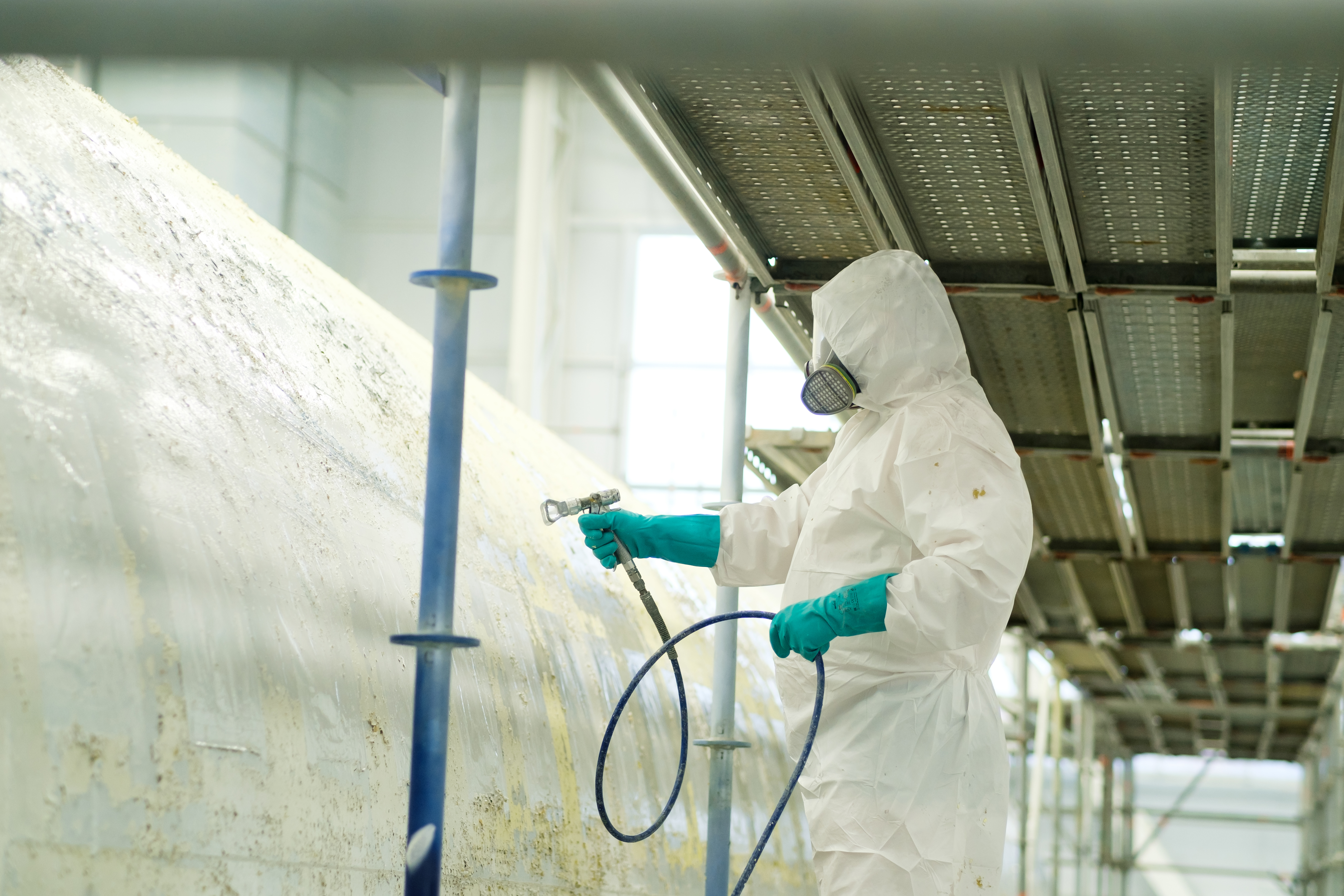 Worker Spray Painting